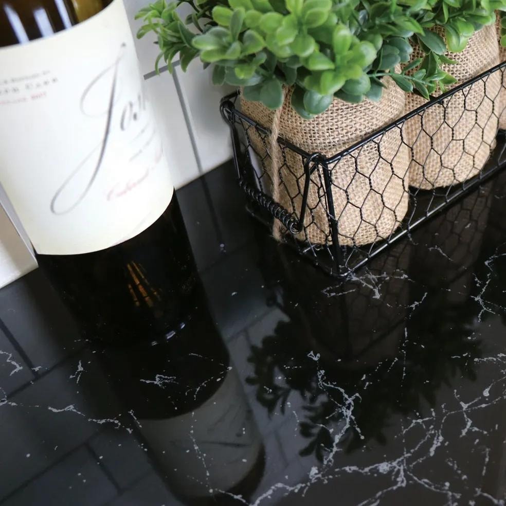Glossy black marble epoxy countertop with white veining Calgary kitchen