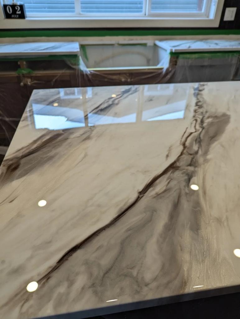 Bold marble swirl epoxy countertop resurfacing Calgary — dramatic veining