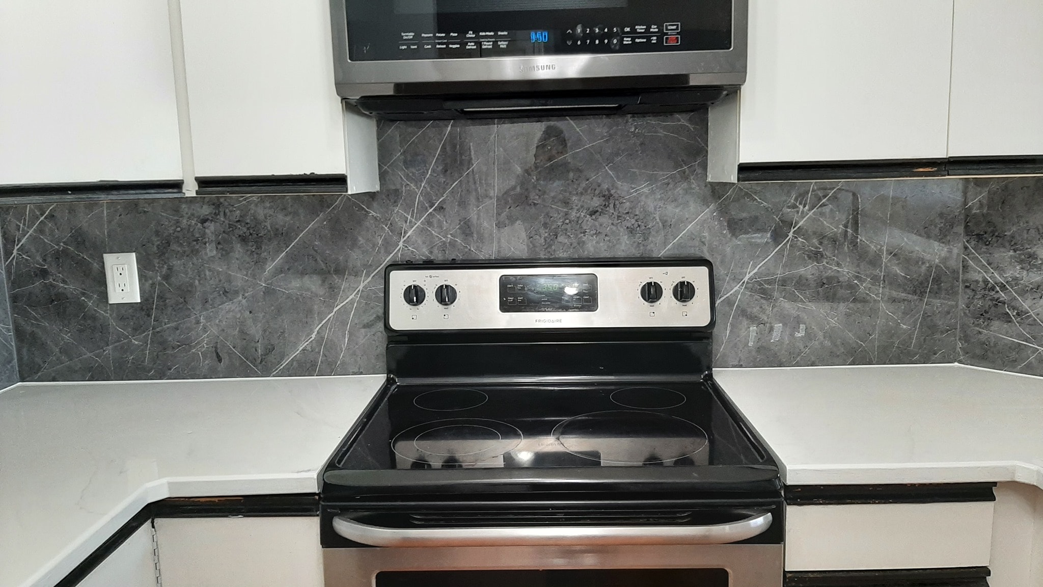 Grey marble-look backsplash reface around kitchen range Calgary
