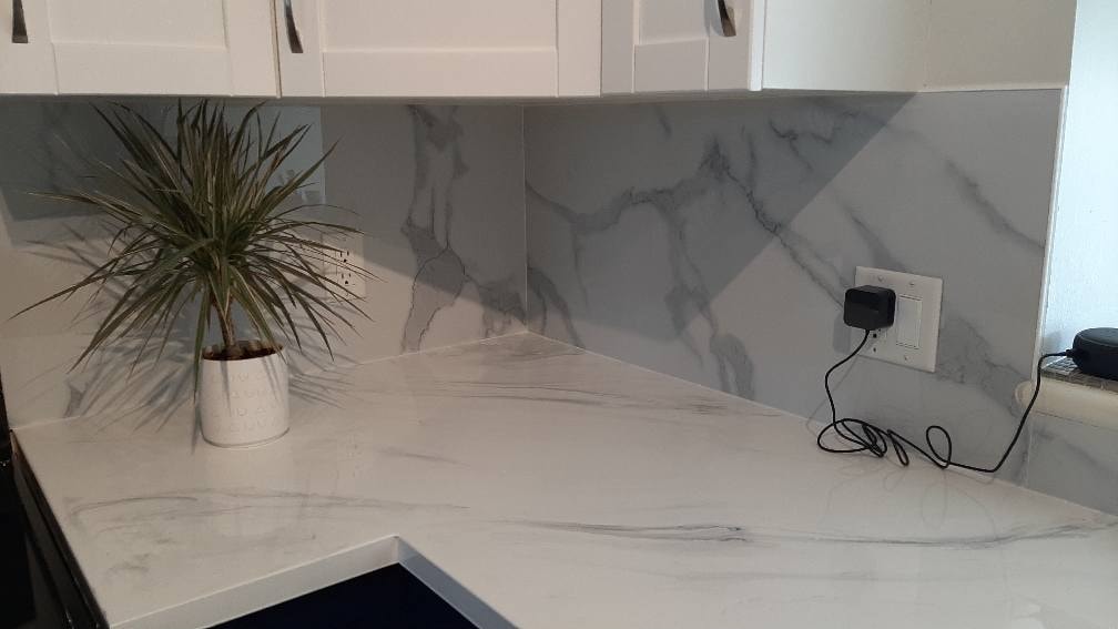 White marble-look backsplash refacing with kitchen countertop Calgary