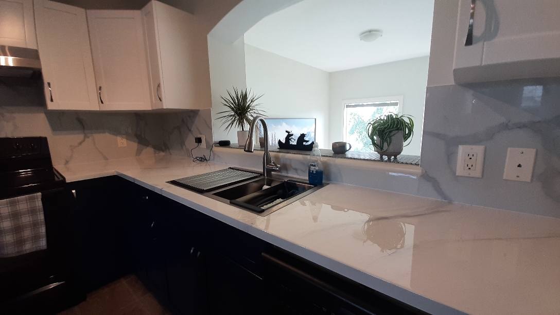 Marble-look backsplash refacing and kitchen renovation Calgary