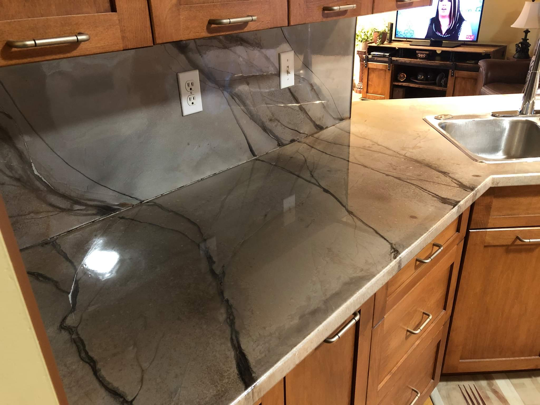 Dark marble-look kitchen countertop and backsplash Calgary