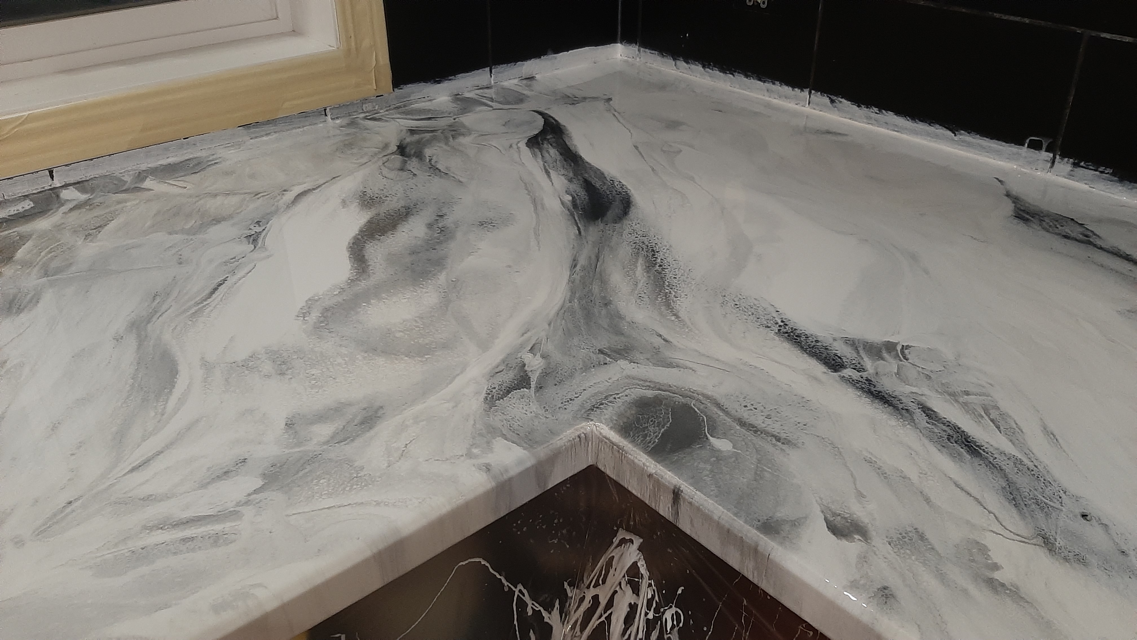 Grey and white marbled epoxy countertop close-up Calgary